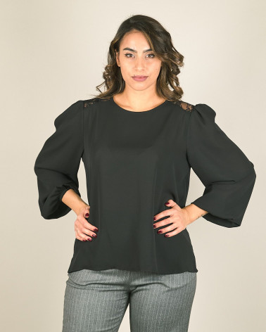 Blusa con manica a sbuffo e pizzo dietro