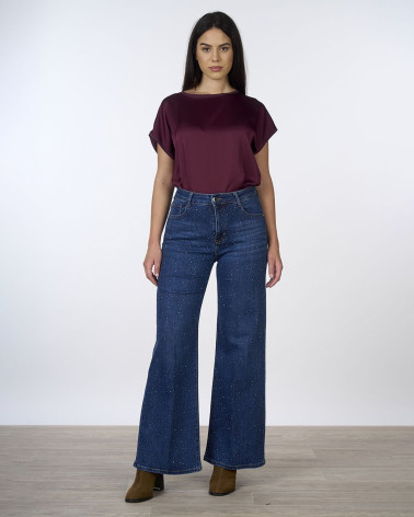 Jeans wide leg con strass all over