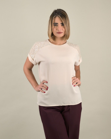 Blusa con spalle in paillettes