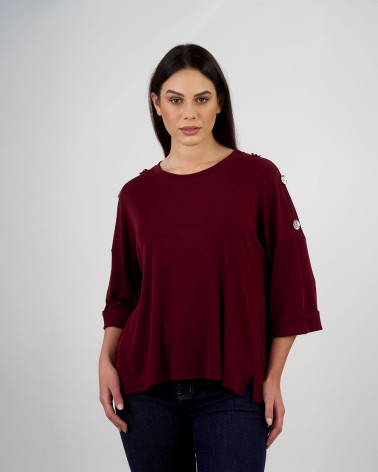 Maglia ampia con bottoni decorativi sulle maniche