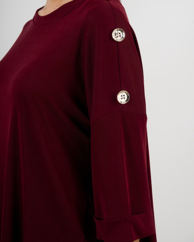Maglia ampia con bottoni decorativi sulle maniche