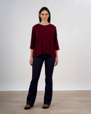 Maglia ampia con bottoni decorativi sulle maniche