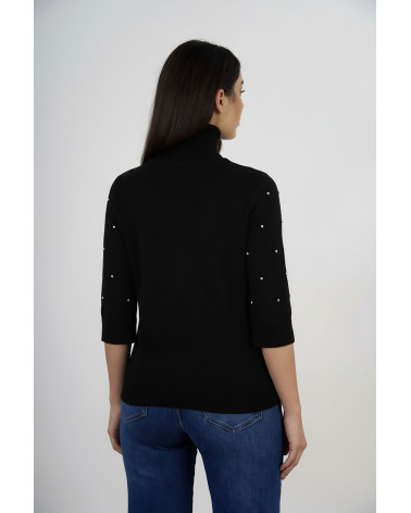 Maglia dolcevita con trama a rombi e applicazioni 