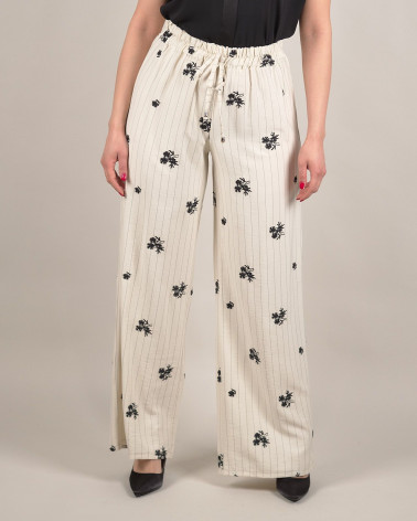 Pantaloni larghi con ricami floreali e righe verti