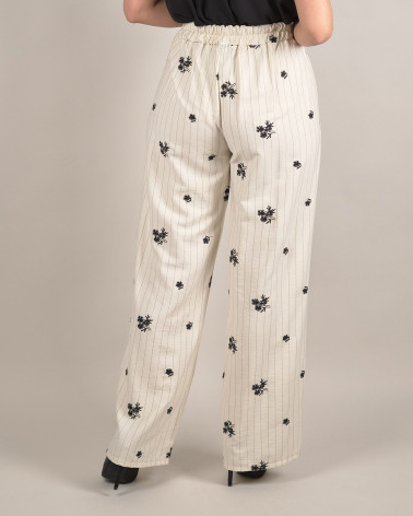 Pantaloni larghi con ricami floreali e righe verti