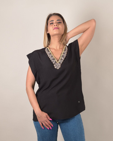 Blusa manica ad aletta con scollo conchiglie