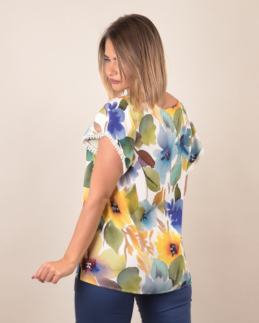 Blusa floreale con profilo decorato
